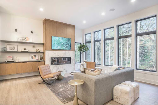 A fireplace with a stone surround is a statement in this living room.